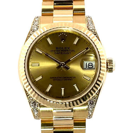 Rolex Datejust 31 Gelbgold 178238 Champagner Zifferblatt Uhr mit 18 kt Gelbgold Armband und geriffelter Lünette.