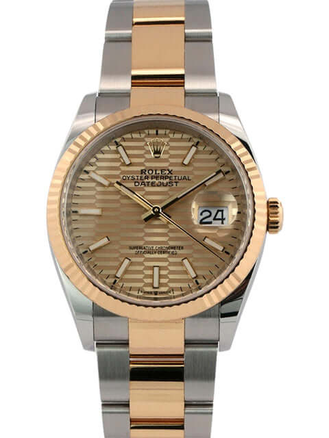 Rolex Datejust 36 Oystersteel Gelbgold 126233 mit goldenem Riffelmuster-Zifferblatt und geriffelter 18 kt Gelbgold Lünette.